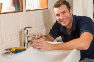Ken repairing a faucet for a customer